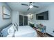 Cozy bedroom with ceiling fan, mounted TV, and stylish decor, creating a relaxing atmosphere at 1025 Riverland Woods Pl # 1108, Charleston, SC 29412