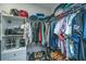 Bright walk-in closet provides ample storage with organized shelving and hanging space at 1025 Riverland Woods Pl # 1108, Charleston, SC 29412