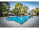 Enjoy community living with a large pool surrounded by beautiful trees at 1025 Riverland Woods Pl # 1108, Charleston, SC 29412