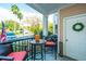 Inviting covered front porch with seating area, perfect for relaxing outdoors at 1025 Riverland Woods Pl # 1108, Charleston, SC 29412
