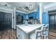 Modern kitchen with stylish blue cabinets, stainless steel appliances, and a kitchen island at 1025 Riverland Woods Pl # 1108, Charleston, SC 29412