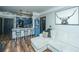 Comfortable living room with an open view to the kitchen and an accent wall art piece at 1025 Riverland Woods Pl # 1108, Charleston, SC 29412