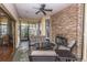 Relaxing screened-in porch with a stone fireplace, perfect for entertaining at 1025 Riverland Woods Pl # 1108, Charleston, SC 29412