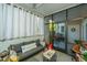 Cozy screened porch offers extra living space with comfortable seating at 1025 Riverland Woods Pl # 1108, Charleston, SC 29412
