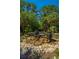 Beautiful water feature with stacked stone urns and mature landscaping in a community of mature trees at 1025 Riverland Woods Pl # 1108, Charleston, SC 29412