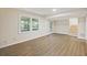 Spacious basement with luxury vinyl plank flooring, natural light, and stairs leading upstairs at 104 Huntington Cir, Summerville, SC 29485