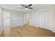 Bedroom with hardwood floors, ceiling fan, closet, and an en suite bathroom at 104 Huntington Cir, Summerville, SC 29485