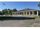 Community clubhouse featuring a long porch with columns and ample parking at 104 Huntington Cir, Summerville, SC 29485