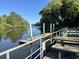 Community dock on the water with picnic tables and views of the trees at 104 Huntington Cir, Summerville, SC 29485
