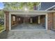Spacious garage with ample storage, brick accent wall, and convenient access to the main house at 104 Huntington Cir, Summerville, SC 29485