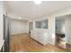 Open-concept kitchen and dining area featuring stainless steel appliances, hardwood floors, and lots of natural light at 104 Huntington Cir, Summerville, SC 29485