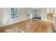Bright living room features hardwood floors, white walls, and natural light from shuttered windows at 104 Huntington Cir, Summerville, SC 29485