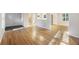 Bright living room with beautiful hardwood floors and an open concept view to the kitchen at 104 Huntington Cir, Summerville, SC 29485