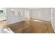 Bright living room featuring beautiful hardwood floors and a view of the kitchen and dining area at 104 Huntington Cir, Summerville, SC 29485