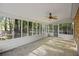 Back porch with brick flooring, ceiling fan, and view of the yard at 104 Huntington Cir, Summerville, SC 29485