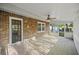 Back porch with brick flooring, ceiling fan, brick exterior, and view of the yard at 104 Huntington Cir, Summerville, SC 29485