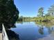 Scenic water view with mature trees, beautiful sky, and serene surroundings at 104 Huntington Cir, Summerville, SC 29485