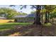 View of the home's backyard with a well-maintained lawn and privacy fence at 1049 Bradford Ave, Charleston, SC 29412