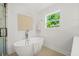Bright bathroom featuring a freestanding tub with modern fixtures and a large window with natural light at 1049 Bradford Ave, Charleston, SC 29412