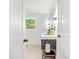 Stylish bathroom featuring a modern vanity with elegant fixtures, a large mirror, and a bright window at 1049 Bradford Ave, Charleston, SC 29412