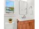Bathroom featuring a wooden vanity, modern fixtures, and a sunny window at 1049 Bradford Ave, Charleston, SC 29412