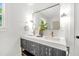 Modern bathroom featuring double sinks with elegant fixtures, a large mirror, and sleek vanity design at 1049 Bradford Ave, Charleston, SC 29412
