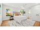Bright bedroom featuring hardwood floors, a comfortable bed with a padded headboard, and ample natural light at 1049 Bradford Ave, Charleston, SC 29412