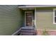 Close up of the front entrance with a five glass paneled door and a brick staircase at 1049 Bradford Ave, Charleston, SC 29412