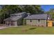 Beautiful two-story house featuring an attached garage, well-kept lawn, and charming exterior details at 1049 Bradford Ave, Charleston, SC 29412
