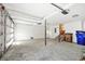 Spacious garage with white walls and high ceilings offers ample room for parking and storage at 1049 Bradford Ave, Charleston, SC 29412