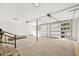 Wide garage with bright, natural light, gray concrete floor, and mechanics to raise the garage doors at 1049 Bradford Ave, Charleston, SC 29412