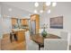 Updated kitchen/dining space, featuring a kitchen island, stainless steel appliances and a rustic dining set at 1049 Bradford Ave, Charleston, SC 29412