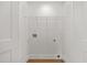 Functional laundry room area with hookups, shelving, and ample space for laundry appliances and storage at 1049 Bradford Ave, Charleston, SC 29412