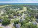 Expansive aerial view of homes nestled in a lush, wooded landscape at 105 Kirkhaven Ct, Goose Creek, SC 29445