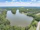 Beautiful lake view surrounded by lush trees and greenery, reflecting a serene and natural landscape at 105 Kirkhaven Ct, Goose Creek, SC 29445