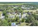 Expansive aerial view of homes nestled in a lush, wooded landscape at 105 Kirkhaven Ct, Goose Creek, SC 29445