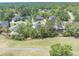 Overhead view of residential neighborhood with homes bordering a serene golf course at 105 Kirkhaven Ct, Goose Creek, SC 29445