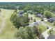 A scenic aerial view of houses bordering lush green spaces and a golf course at 105 Kirkhaven Ct, Goose Creek, SC 29445