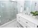 Bright bathroom with a walk-in shower, a white vanity, and marble countertops at 105 Kirkhaven Ct, Goose Creek, SC 29445