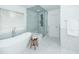 Modern bathroom with a free-standing tub, walk-in glass shower, stool and marble tiled floor, with natural light at 105 Kirkhaven Ct, Goose Creek, SC 29445