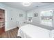 Neutrally decorated bedroom features white trim, wood-look floors and modern ceiling fan at 105 Kirkhaven Ct, Goose Creek, SC 29445