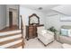 Spacious landing area with stairs, including a dresser and comfortable chair at 105 Kirkhaven Ct, Goose Creek, SC 29445