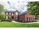Attractive brick home featuring manicured landscaping, black shutters, and a classic architectural style at 105 Kirkhaven Ct, Goose Creek, SC 29445