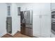 Modern kitchen featuring stainless steel refrigerator and white cabinets and hardwood floor at 105 Kirkhaven Ct, Goose Creek, SC 29445