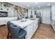 Open kitchen with white cabinets, hardwood floors, and stainless steel appliances at 105 Kirkhaven Ct, Goose Creek, SC 29445