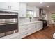 Modern kitchen with stainless steel appliances and white cabinets at 105 Kirkhaven Ct, Goose Creek, SC 29445