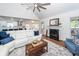 Cozy living room with vaulted ceiling, a fireplace, and bright light at 105 Kirkhaven Ct, Goose Creek, SC 29445