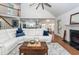 Open concept living room with fireplace and a view to the kitchen and dining area at 105 Kirkhaven Ct, Goose Creek, SC 29445