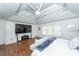 Spacious bedroom with a custom media center, hardwood floors, and elegant ceiling fan at 105 Kirkhaven Ct, Goose Creek, SC 29445