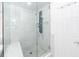 Modern glass shower with stylish fixtures, a built-in seat, and elegant gray and white tiling with detailed floor at 105 Kirkhaven Ct, Goose Creek, SC 29445
